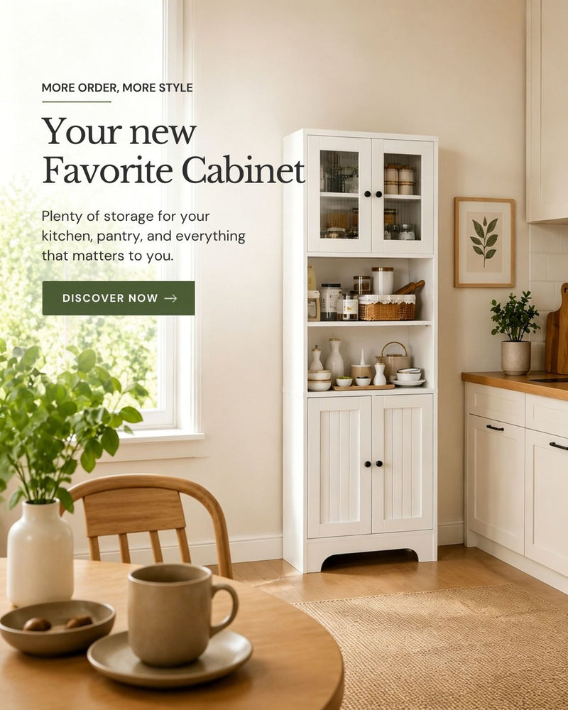 White kitchen cabinet with glass doors and open shelves, filled with dishes and pantry items. Bright kitchen with table and plant on the left, countertop with potted plant on the right.